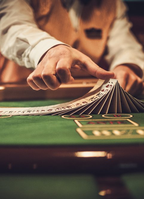 Croupier behind a gambling table in a casino