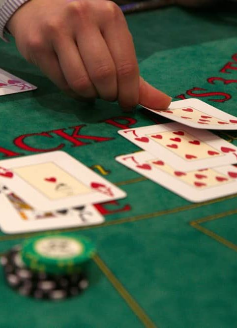 Dealer deals the playing cards at a blackjack table