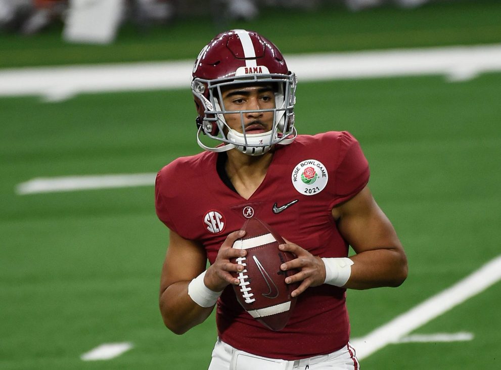 American football player looks to pass during a game