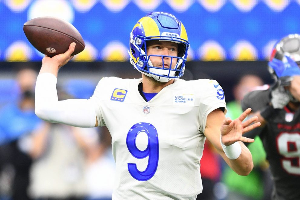 American football player looks to pass during a game