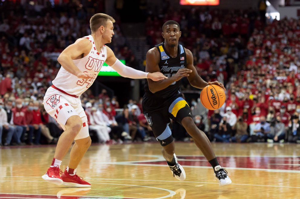 Basketball players battle for the ball during a game