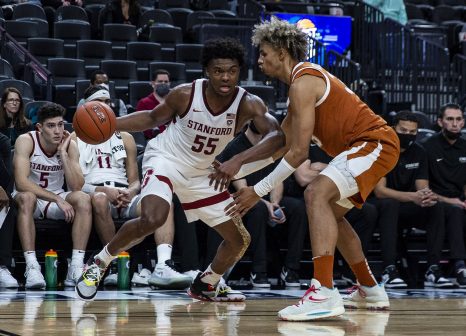 Basketball player runs the ball during a game