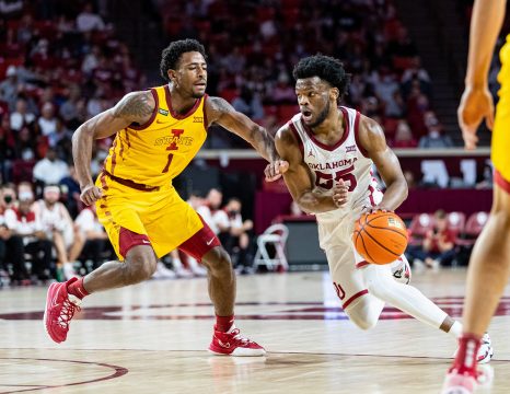 Basketball player drives to the basket during a game