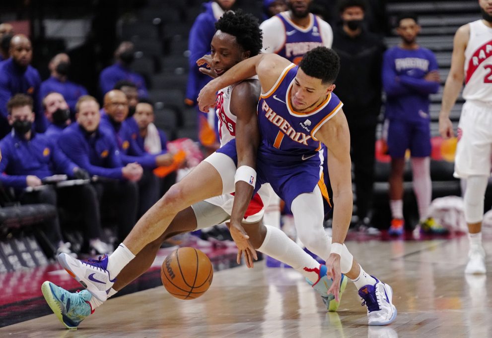 Basketball players battle for the ball during a game