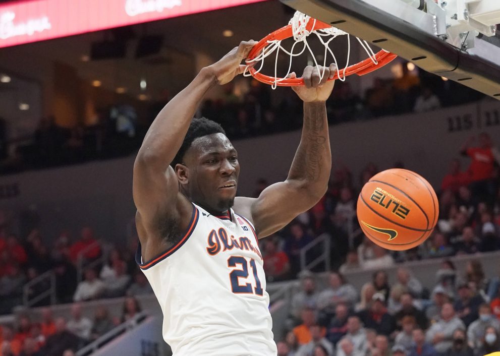 Basketball player dunks the basketball during a game