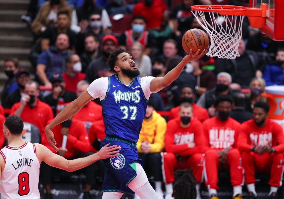 Basketball player drives to the basket after a whistle during a game