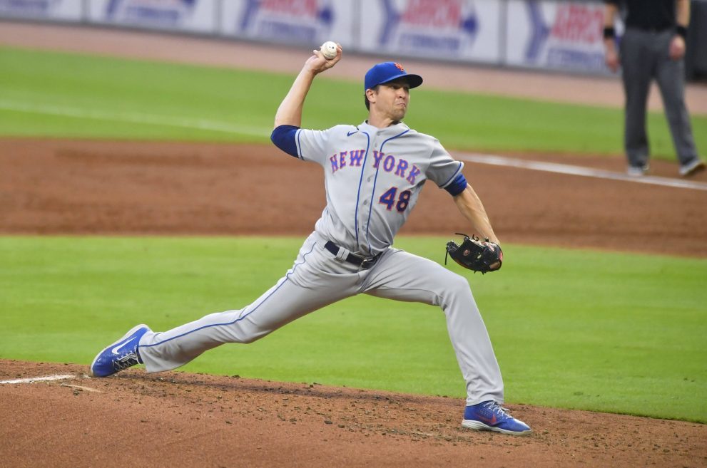 Baseball player delivers a pitch during a baseball game