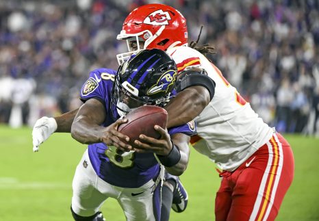 American Football player runs for a game touchdown during a match