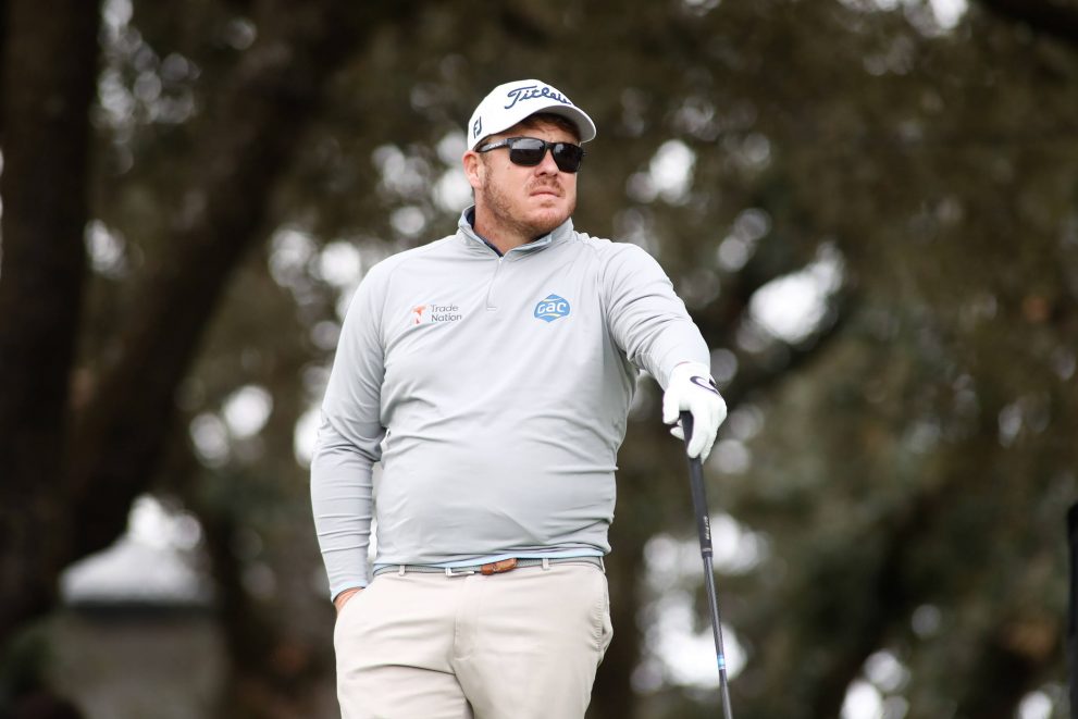 Golf player looks on during golf game