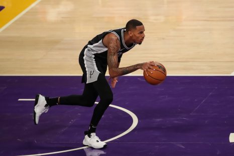 Basketball player runs the ball during a game