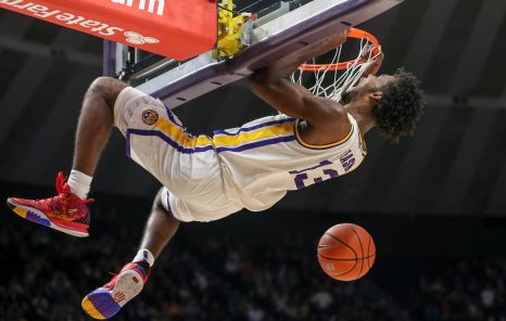 Slam dunk of a basketball player during a game