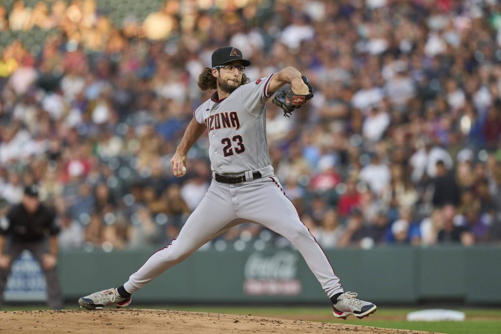 Baseball player throws a pitch during a game