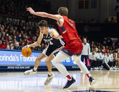 Basketball player drives to the hoop during the game