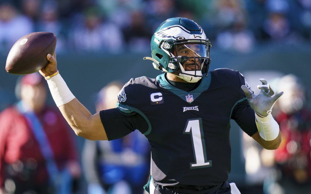 American football player throws the ball during a match