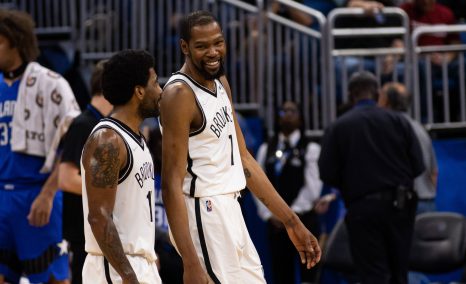 Two basketball players talk after the match end