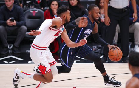 Basketball player dribbles during a match