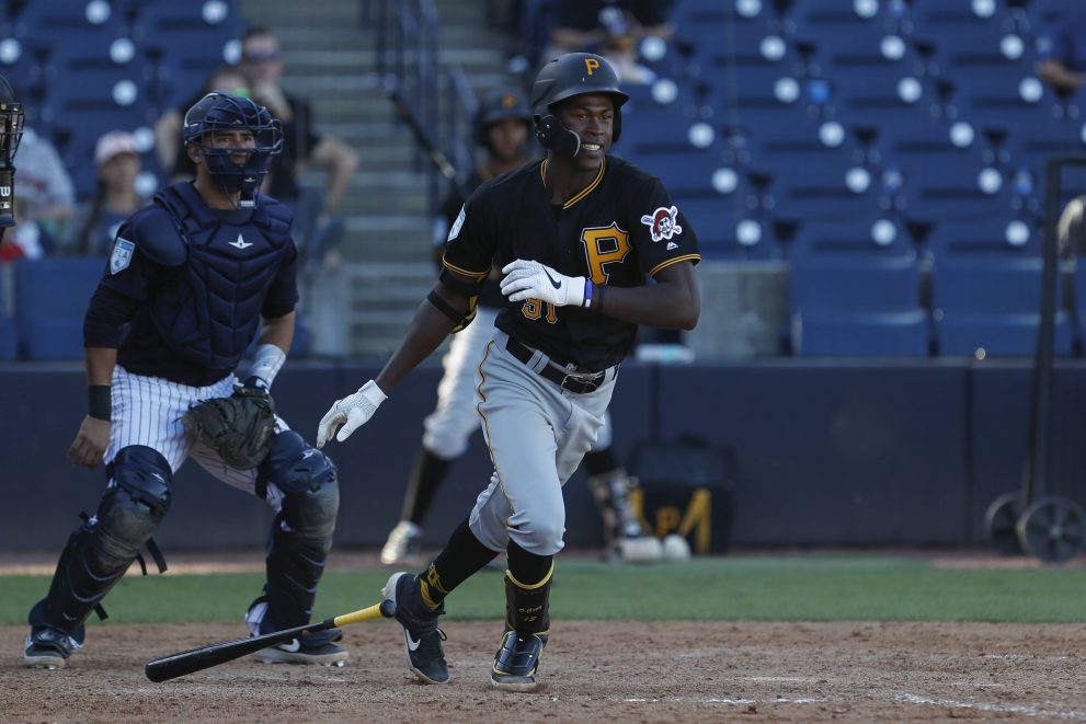 Baseball player runs after hits the ball during a game