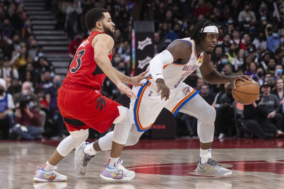 Basketball player dribbles during a match