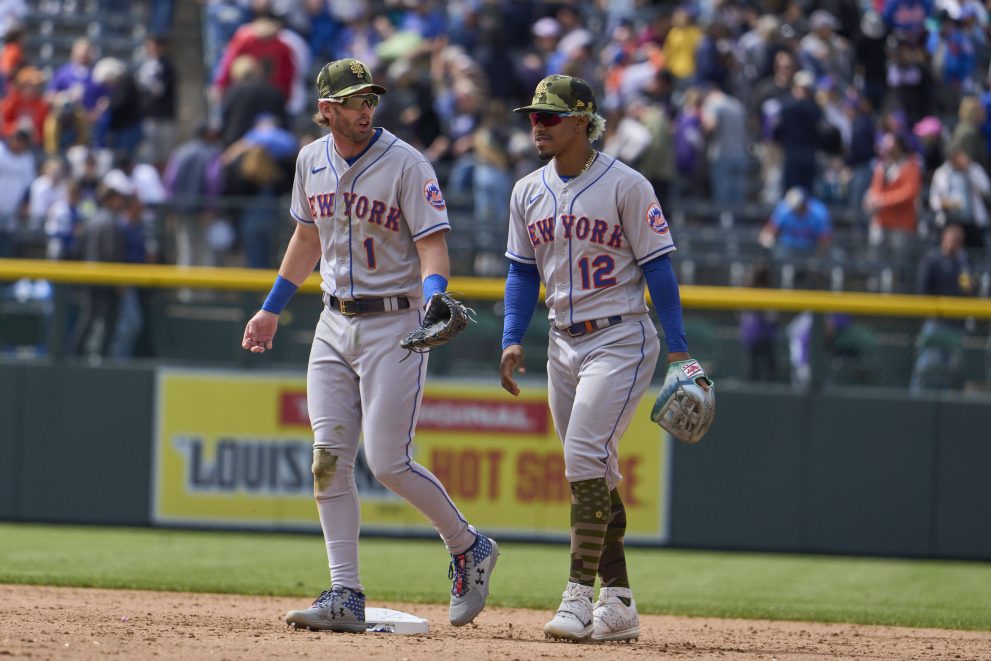 Two baseball players talk after the game