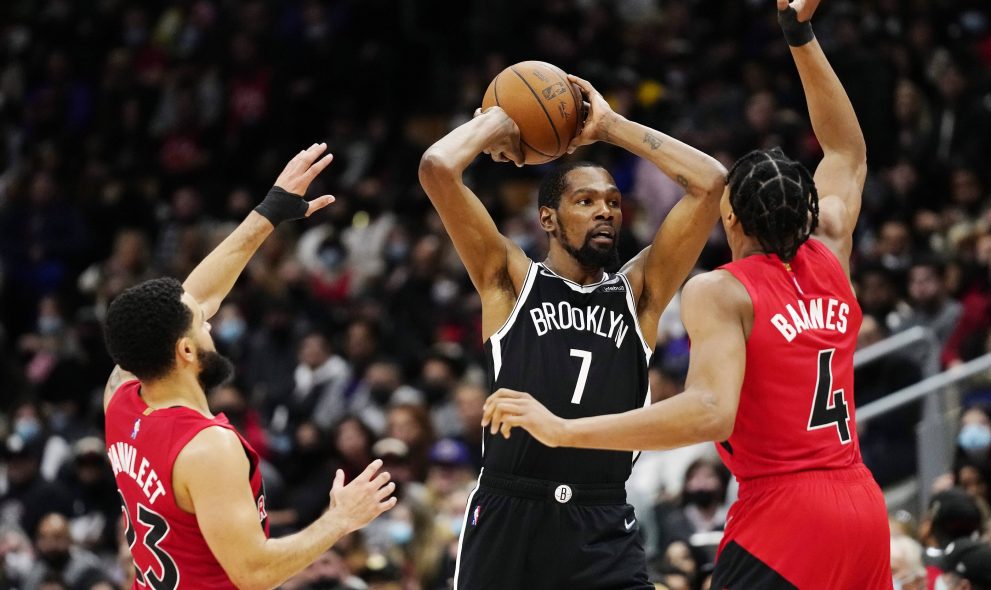 Basketball player passes the ball during a game