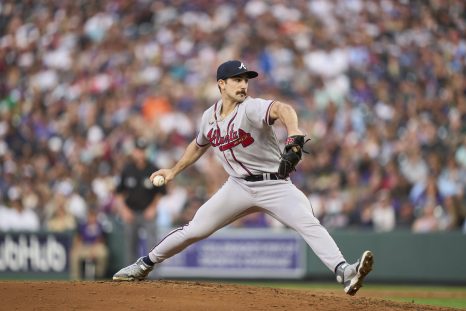 Baseball player throws a pitch during the game