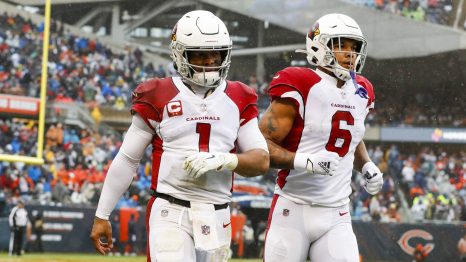 Two American football players enter on the field before the match starts