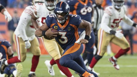 American football player runs to a touchdown during a match