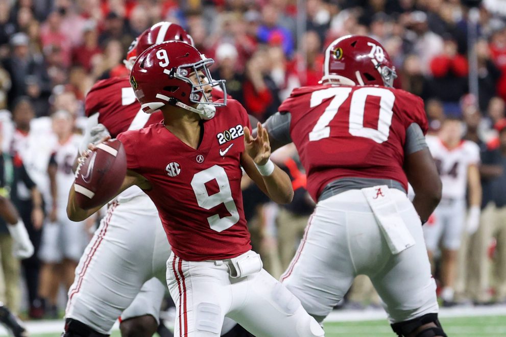 American football player throws the ball during a match