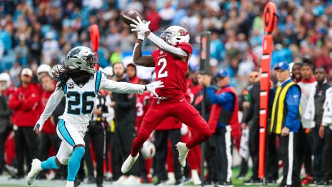 American Football player catches the ball during a match