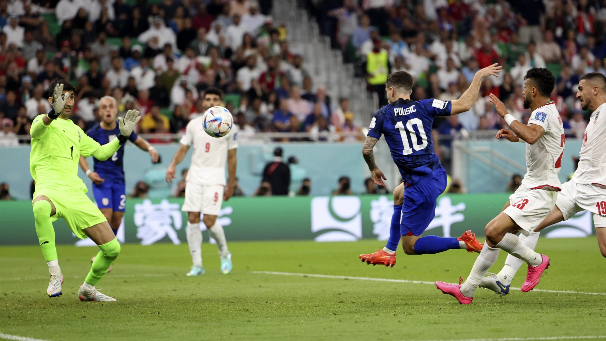 A goalkeeper catches the ball during a soccer match