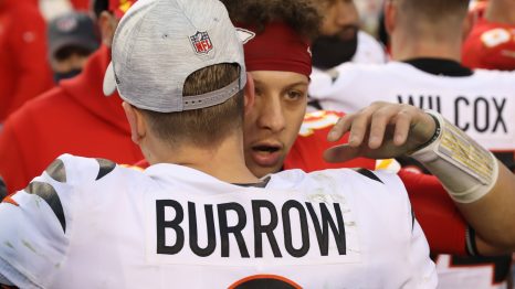 Two American football players celebrate a winning