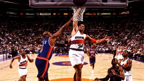 A basketball player's slam dunk during a game