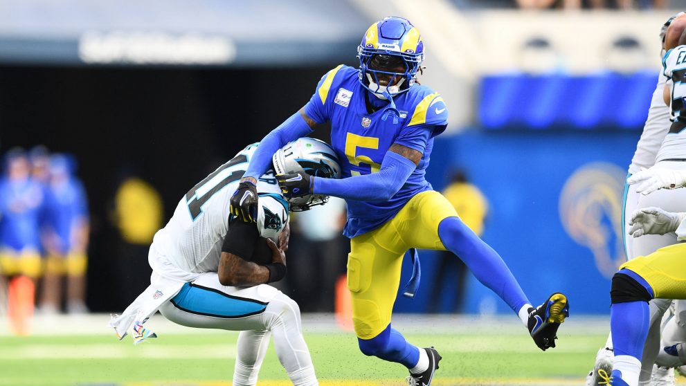 Two american football players fight for the ball during the match