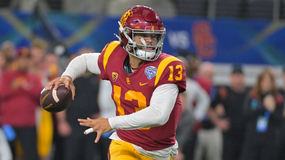 American football player throws the ball during a game