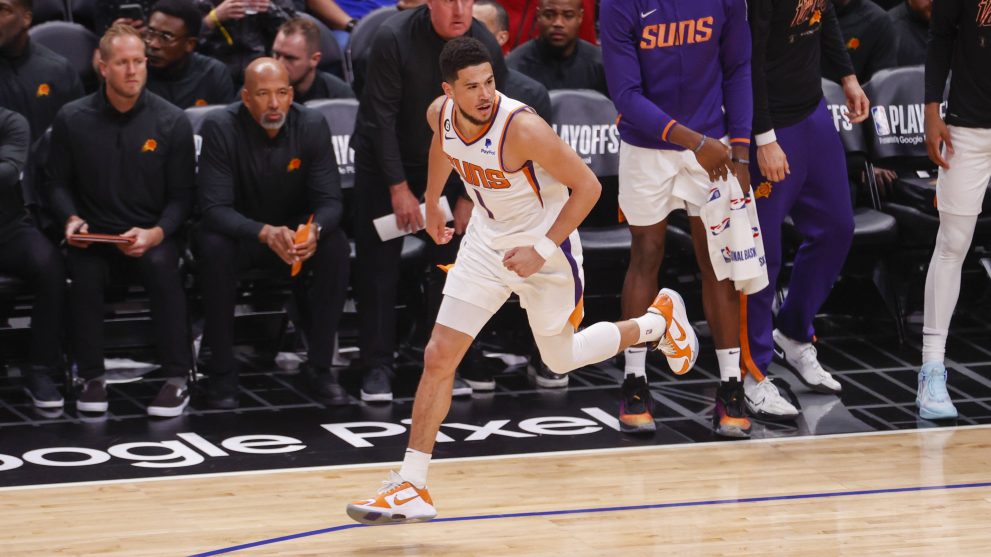 Basketball player runs to catch the ball during a game