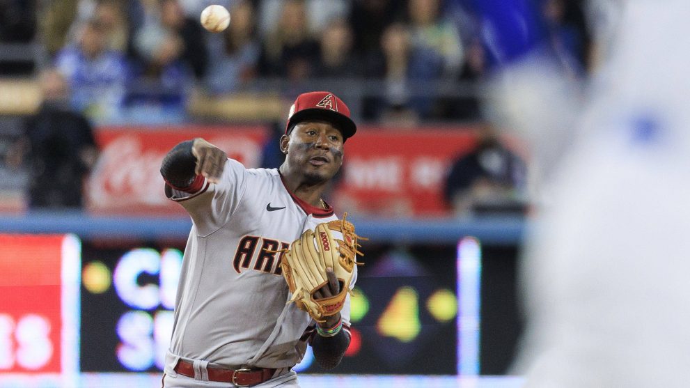 Baseball player throws the ball during a game