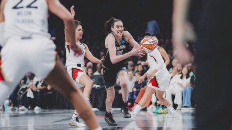 Breanna Stewart drives past Kelsey Plum to the rim