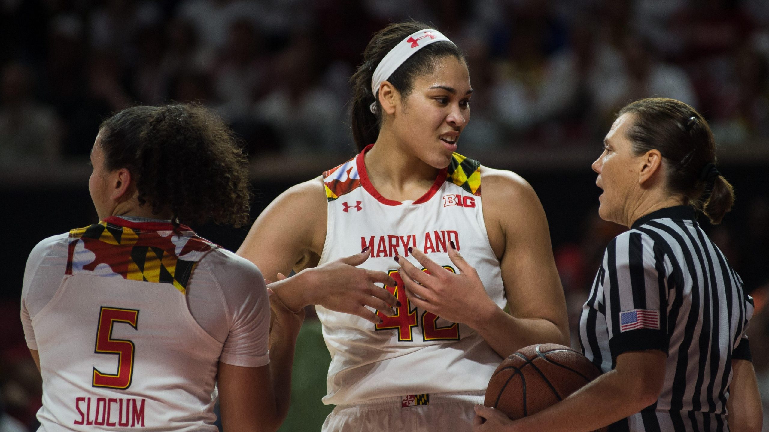Brionna Jones talks to a referee mid-game while playing for the Maryland Terrapins in 2016