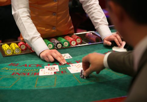 A man player bets on blackjack table