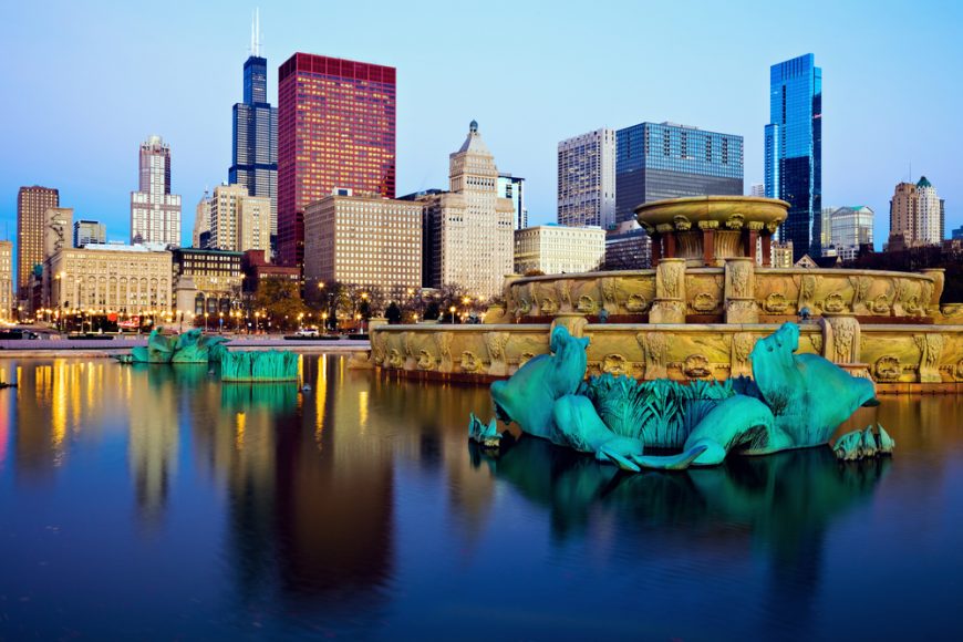 Chicago skyline reflected in Buckingham Fountain. Chicago Illinois USA