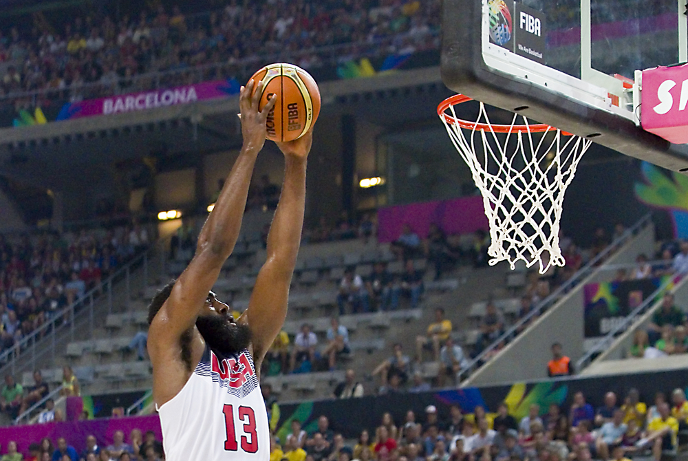 Basketball player slam dunk during a match