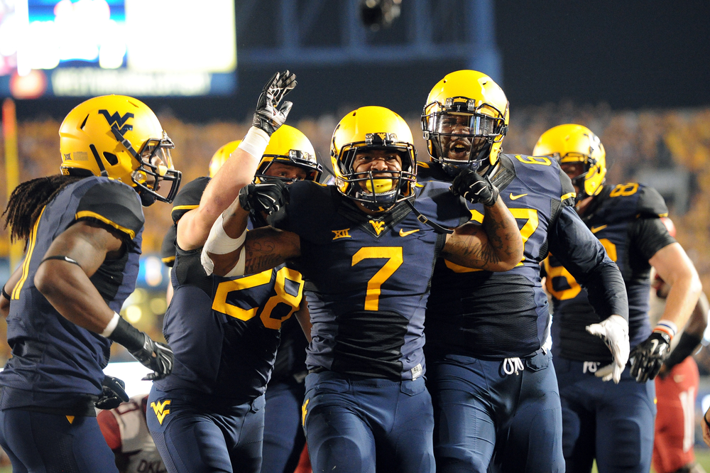 American Football players celebrate a victory