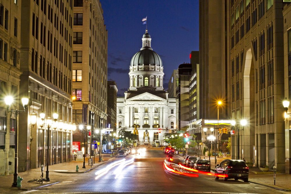 The Indiana capitol building at night in Indianapolis