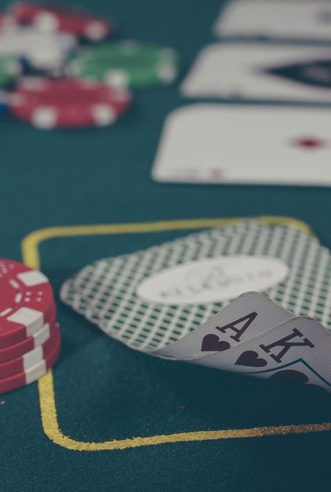 Poker player checks his hands during a poker game