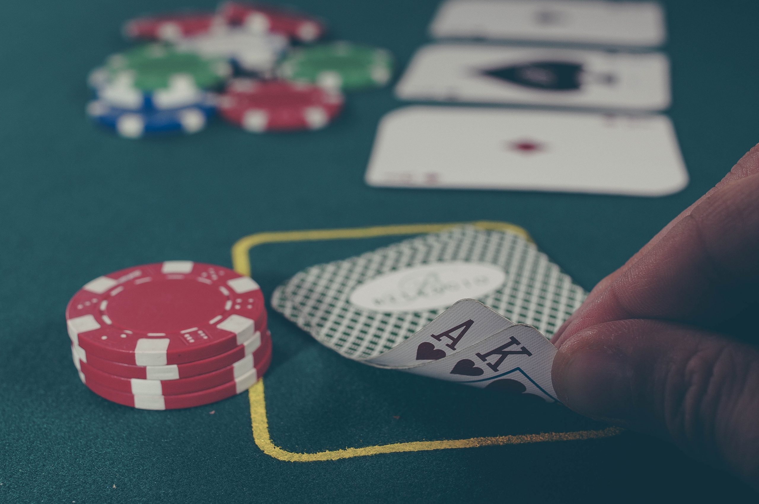 Poker player checks his hands during a poker game