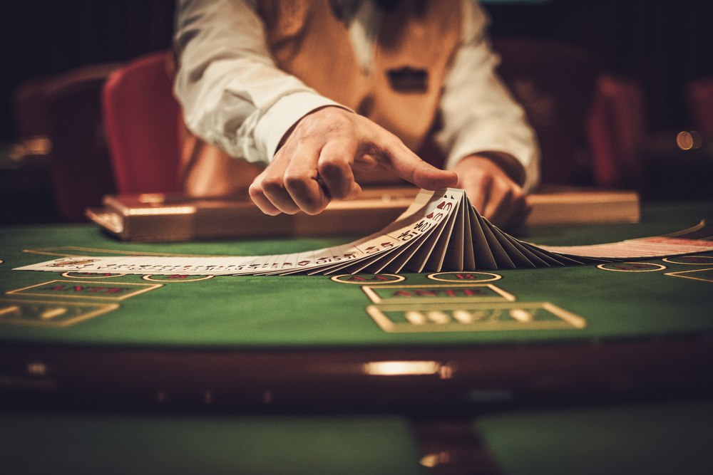 Croupier behind gambling table in a casino.