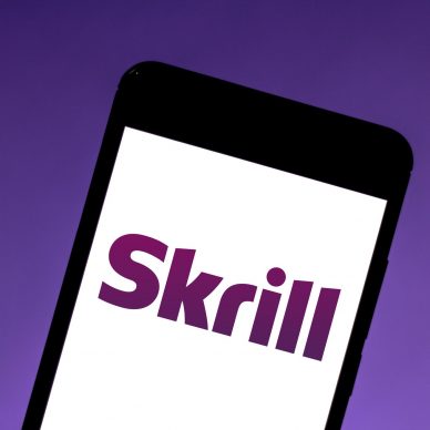 Skrill logo on a phone display