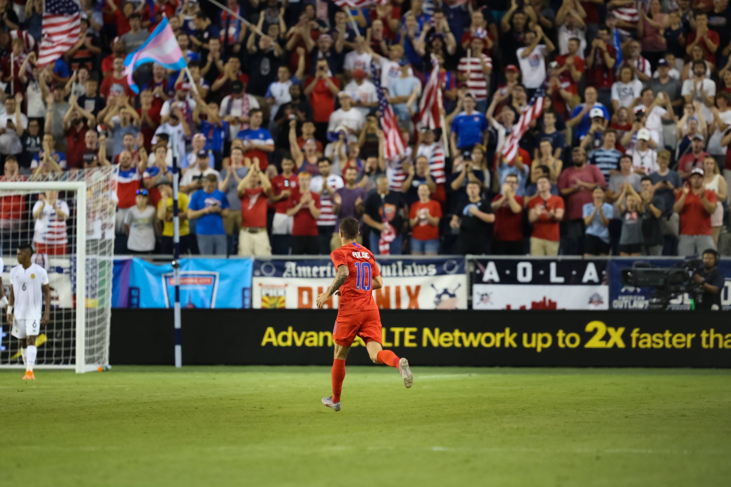 Football player enters the game to the delight of the fans during a match