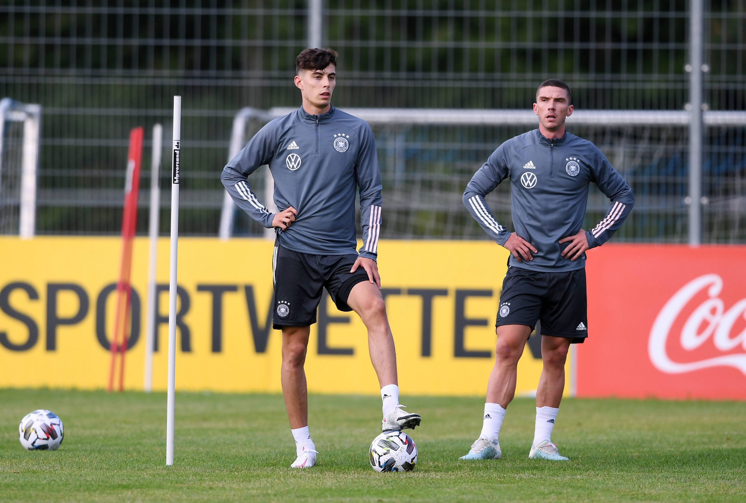 Two football players on a training ground.