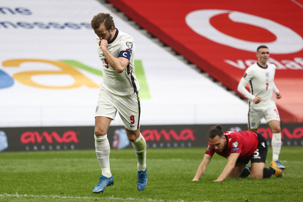 Football player celebrates after scoring by kissing his ring